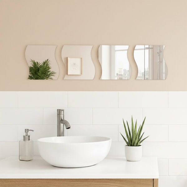 "Four wave-shaped mirrors arranged in a horizontal row above a white vessel sink in a modern bathroom"