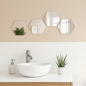 "Four hexagonal mirrors in horizontal row above a white vessel sink in a modern bathroom"