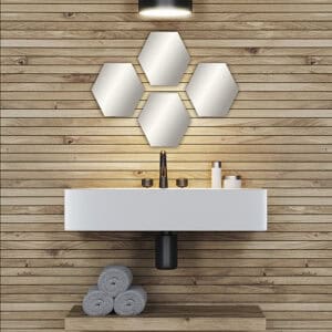 "Four hexagonal frameless mirrors in honeycomb arrangement above a floating bathroom vanity with wood plank wall"
