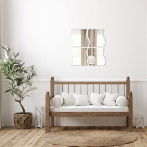 "Four large wave-shaped mirrors in 2x2 grid above a rustic wooden bench in a farmhouse-style room"