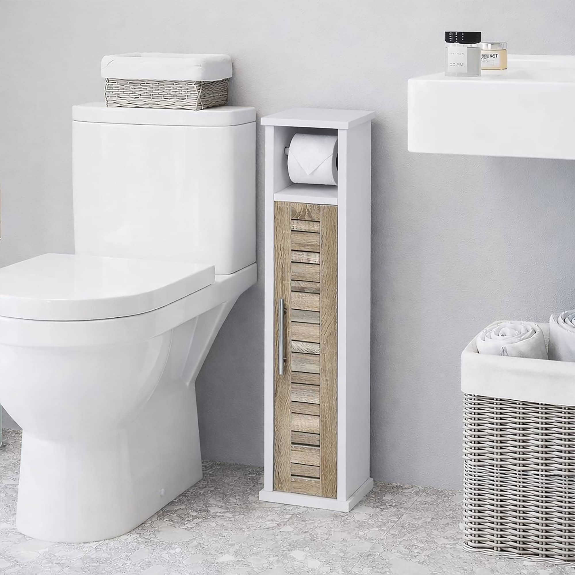 "Narrow white and oak toilet paper storage cabinet with roll holder, placed beside a toilet in a modern bathroom"