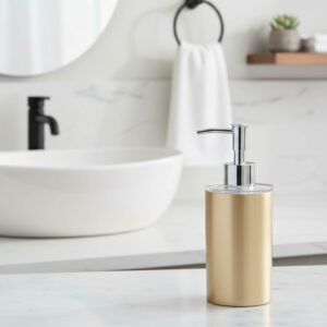 Brushed gold soap dispenser on modern bathroom countertop