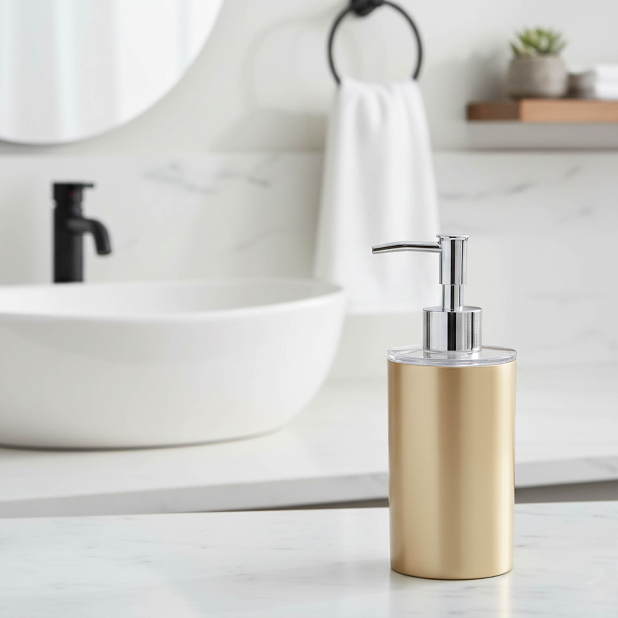Brushed gold soap dispenser on modern bathroom countertop