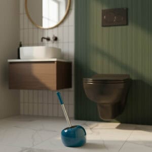 Peacock blue spherical toilet brush holder with stainless steel handle in contemporary bathroom with green wall