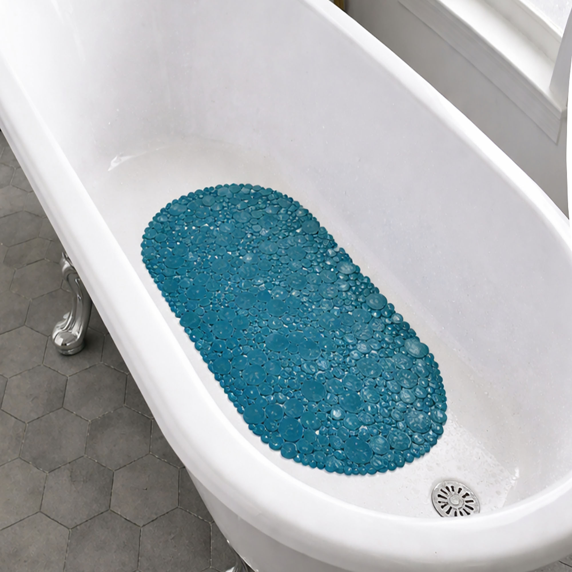 Peacock blue pebbles bathtub mat in white tub