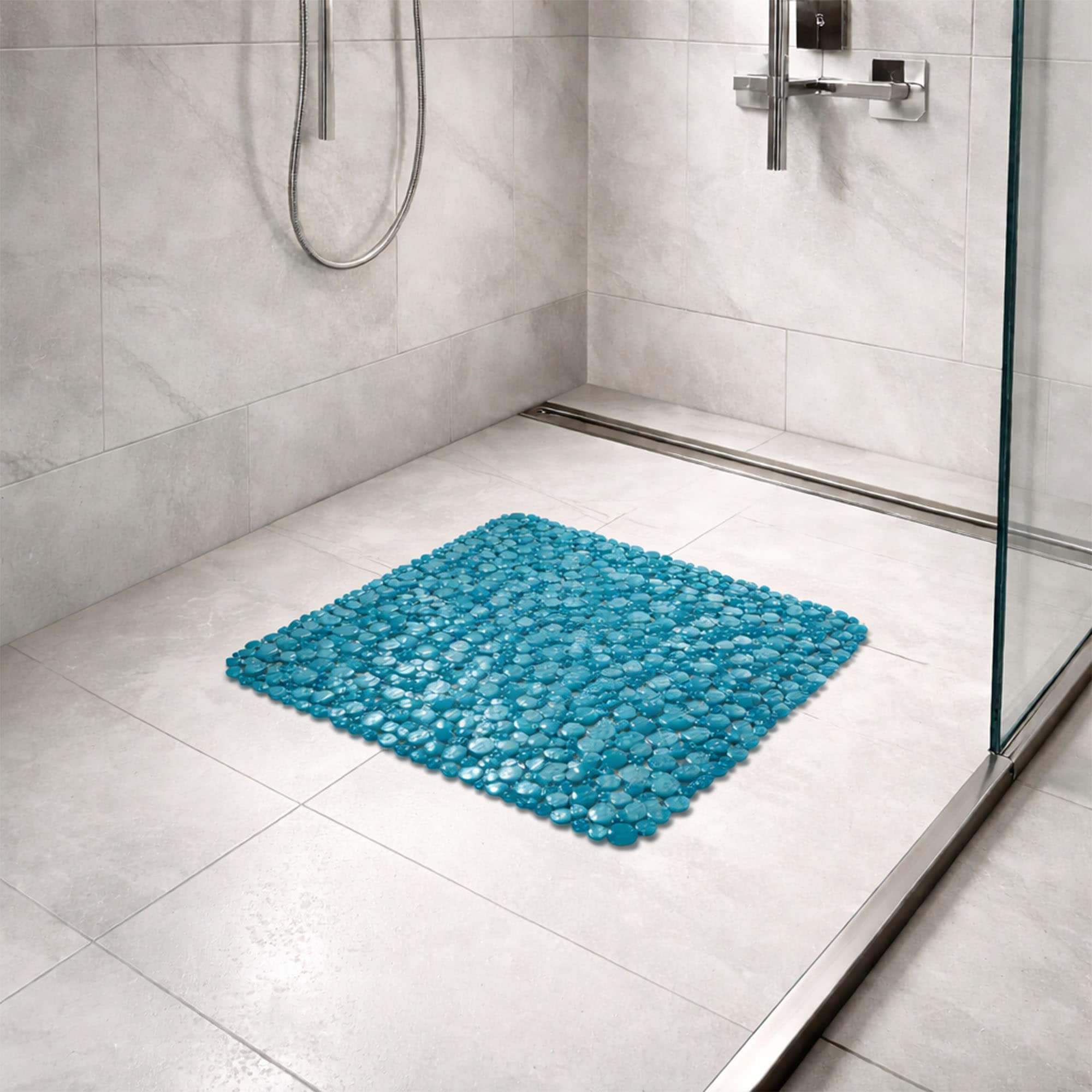 Peacock blue bubble-pattern shower mat on tile shower floor