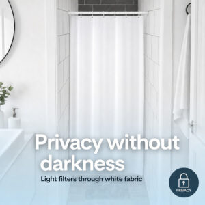 White fabric shower curtain letting daylight through while giving privacy in a narrow shower stall