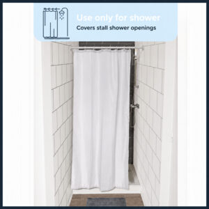 White 48 x 72 inch shower curtain covering the opening of a small tiled shower stall