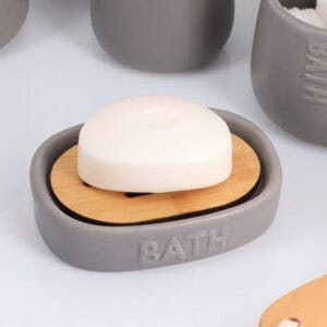 Side view of grey soap dish with bamboo anti melt tray