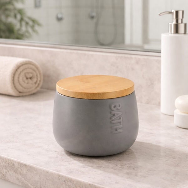 Gray cotton box with bamboo lid on bathroom counter