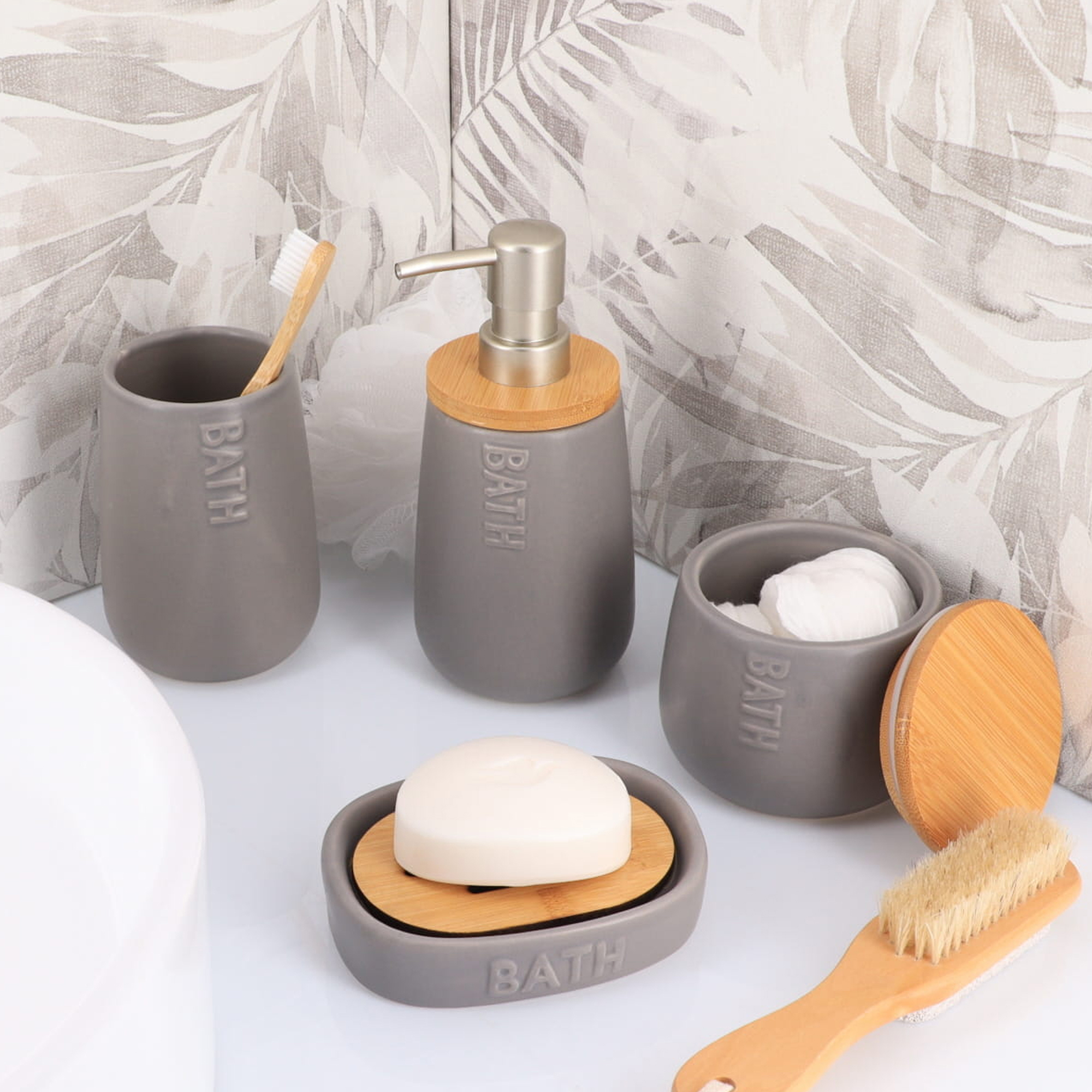 Gray bathroom accessories set with bamboo accents