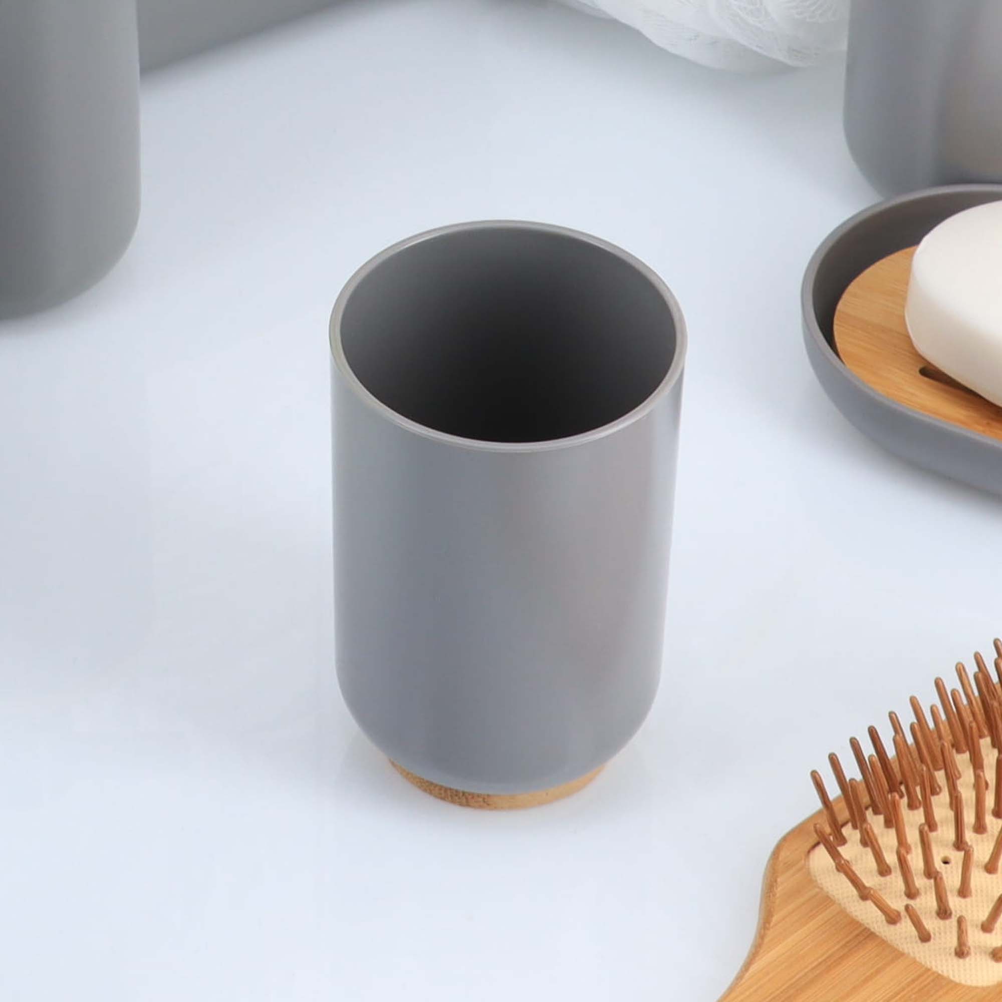 Gray bamboo base tumbler on white surface