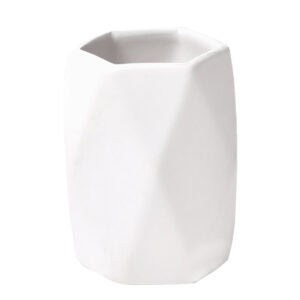 White faceted bathroom tumbler cup on white background