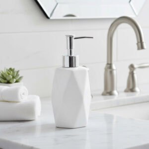 White stoneware soap dispenser on bathroom vanity with chrome pump