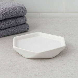 Empty white geometric soap dish on vanity surface