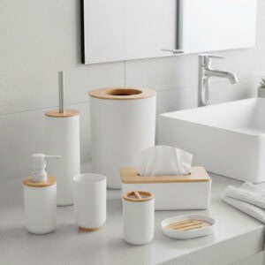 White and bamboo bathroom accessories collection including tissue box, trash bin, soap dispenser, and organizers