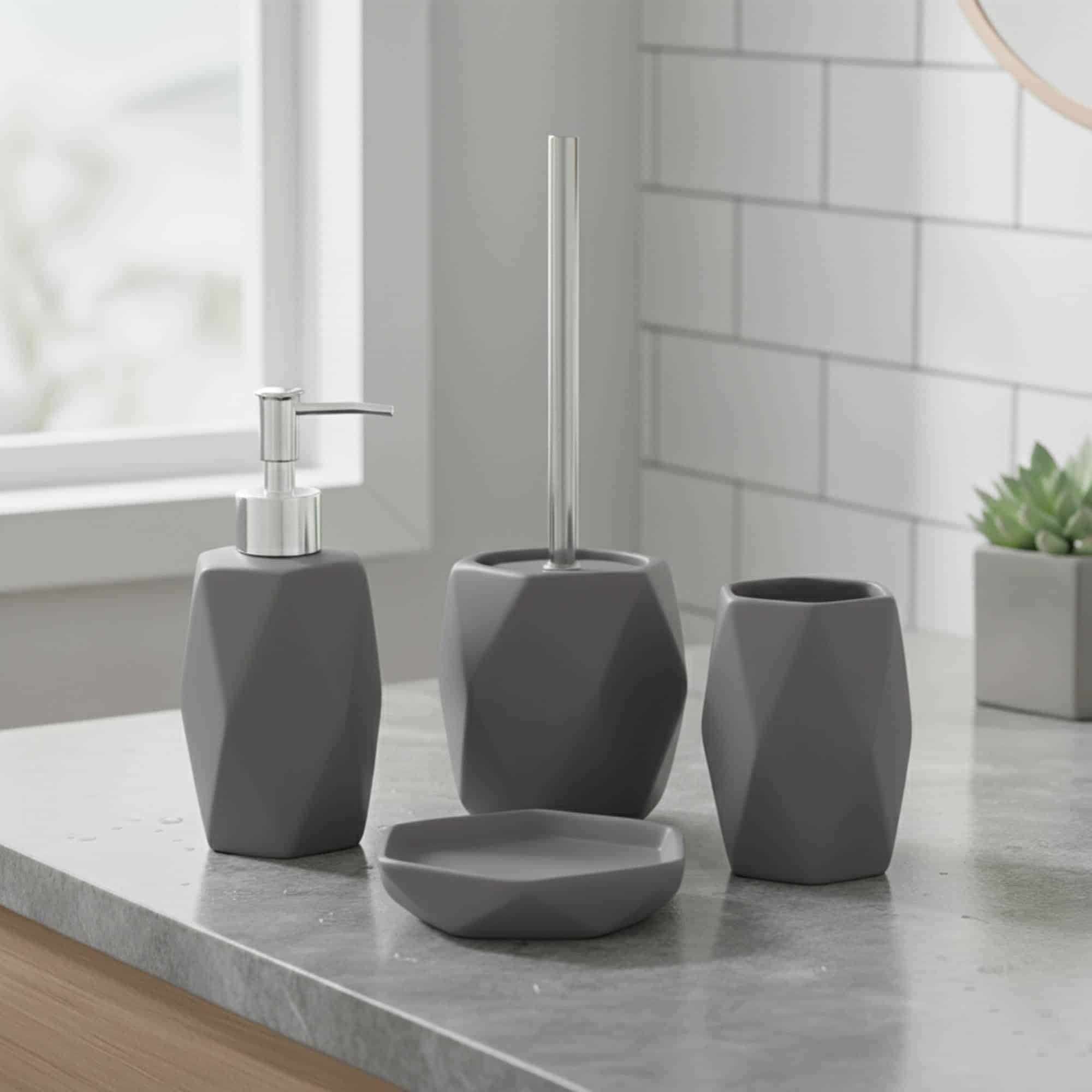 Matte gray 4-piece bathroom accessory set on countertop with pump, tumbler, soap dish, and toilet brush