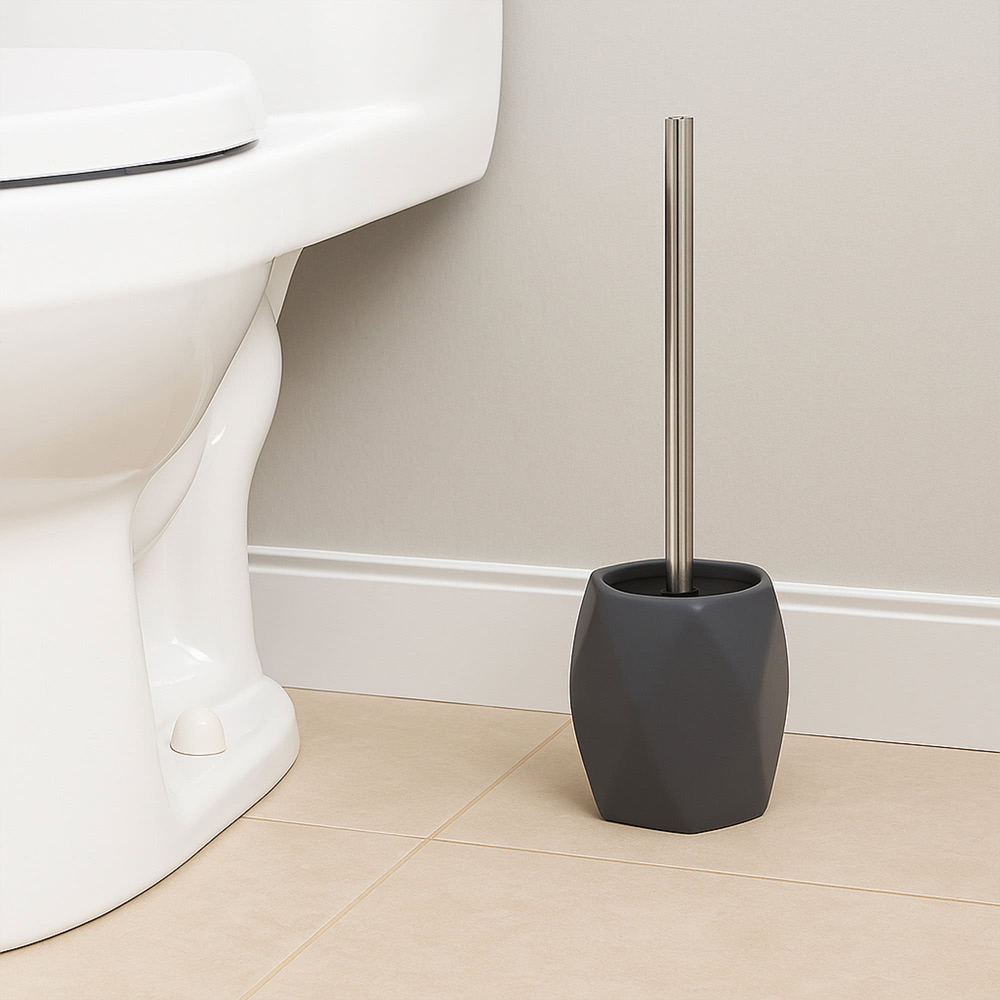 Gray diamond toilet brush holder placed beside white toilet