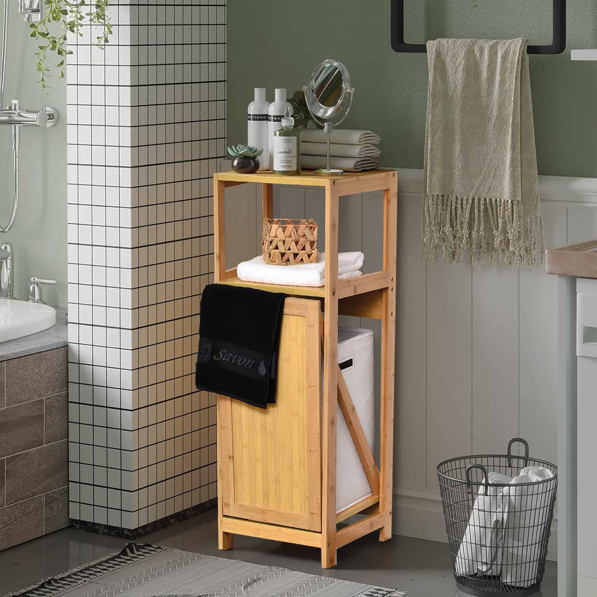 Bamboo Laundry Cabinet in Modern Bathroom Setup – The bamboo cabinet is shown in a stylish bathroom setting with towels and decor items arranged, enhancing a modern bathroom space.