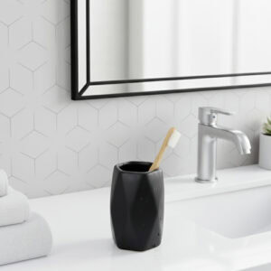 Matte black bathroom tumbler on modern vanity sink