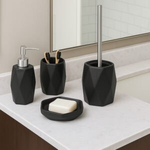 Black diamond-shaped bathroom accessory set including soap dispenser, tumbler, toilet brush, and soap dish on white vanity