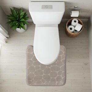 Top-down view of taupe pebble-texture contour mat fitted around toilet base