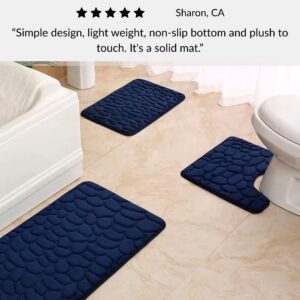 Navy blue contour, runner and standard memory foam mats with pebble design positioned around toilet and customer review overlay
