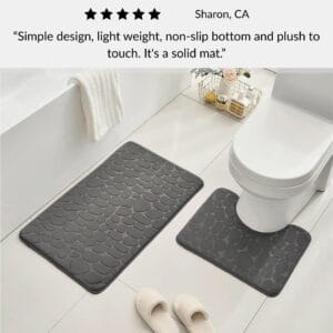 Dark gray contour and standard memory foam mats with pebble design positioned around toilet with slippers and customer review overlay