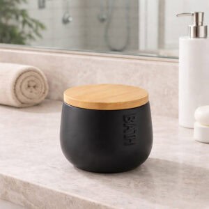 Black cotton box with bamboo lid on bathroom counter