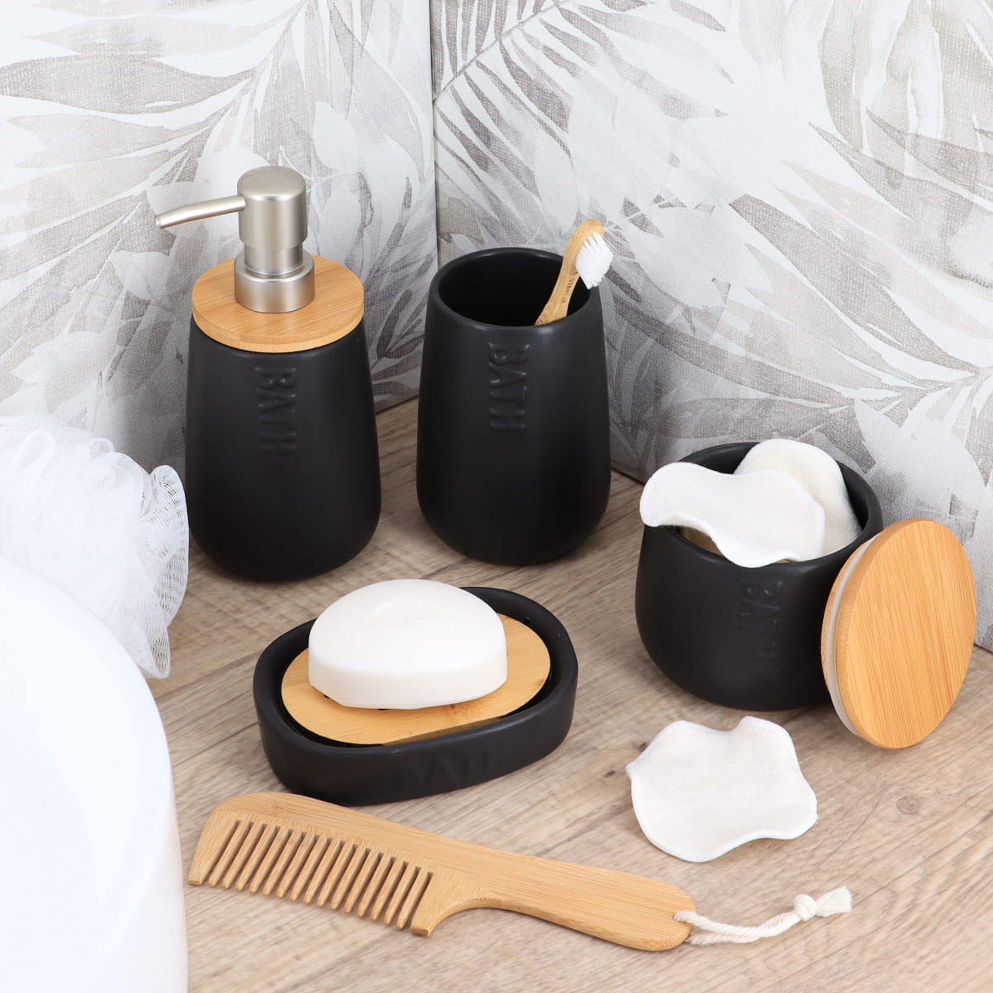 Black bathroom accessories set with bamboo accents