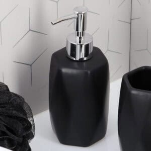 Close-up of matte black soap dispenser with chrome pump