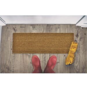 coco doormat in situation with boots and umbrella