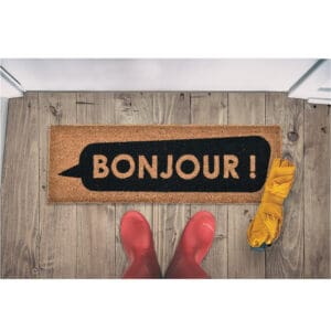 coco doormat in situation with boots and umbrella