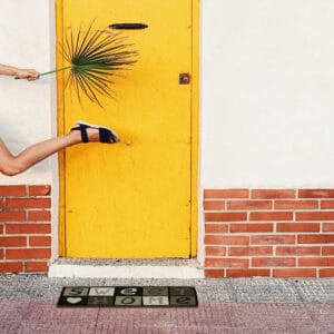 door mat in natural fibers outside in the street at entrance door