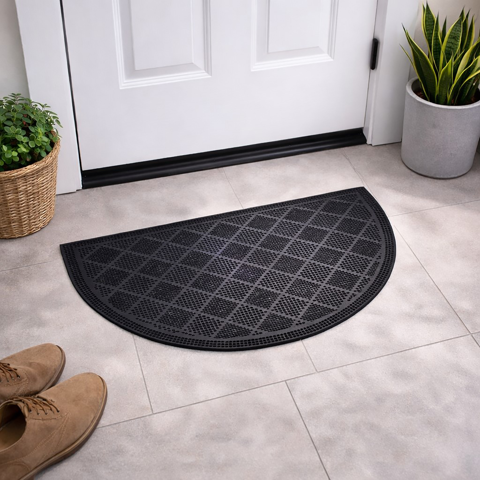 Half round rubber doormat placed at front door entryway