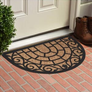 Coir and rubber doormat placed in front of a white door