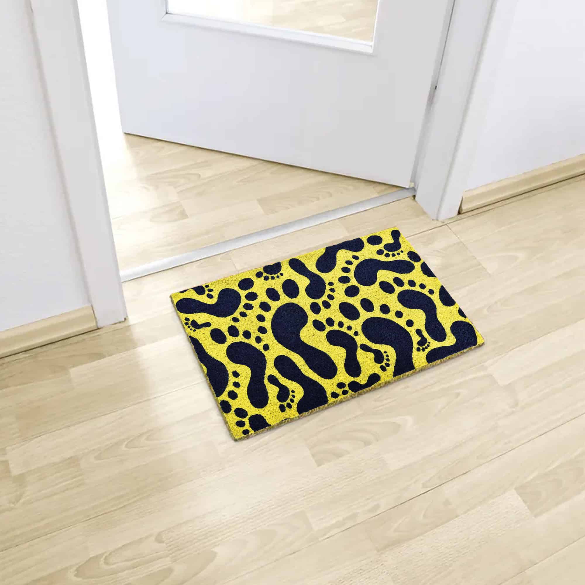 printed coco mat on the floor in front of inside door