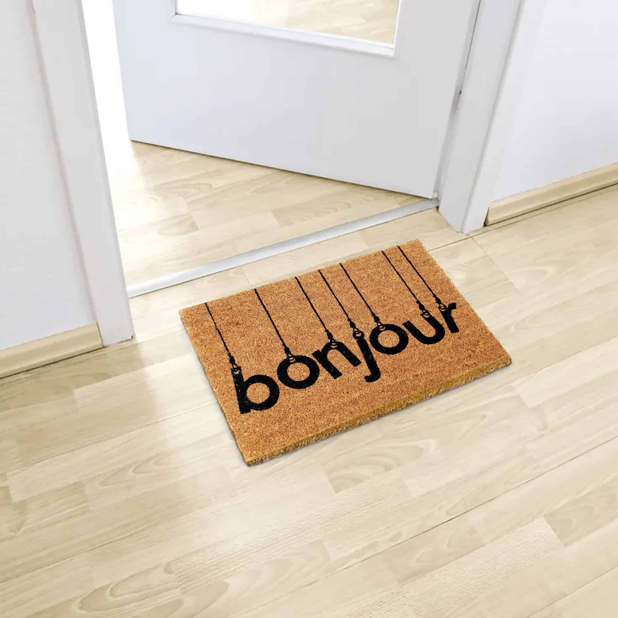 printed coco mat on the floor in front of inside door