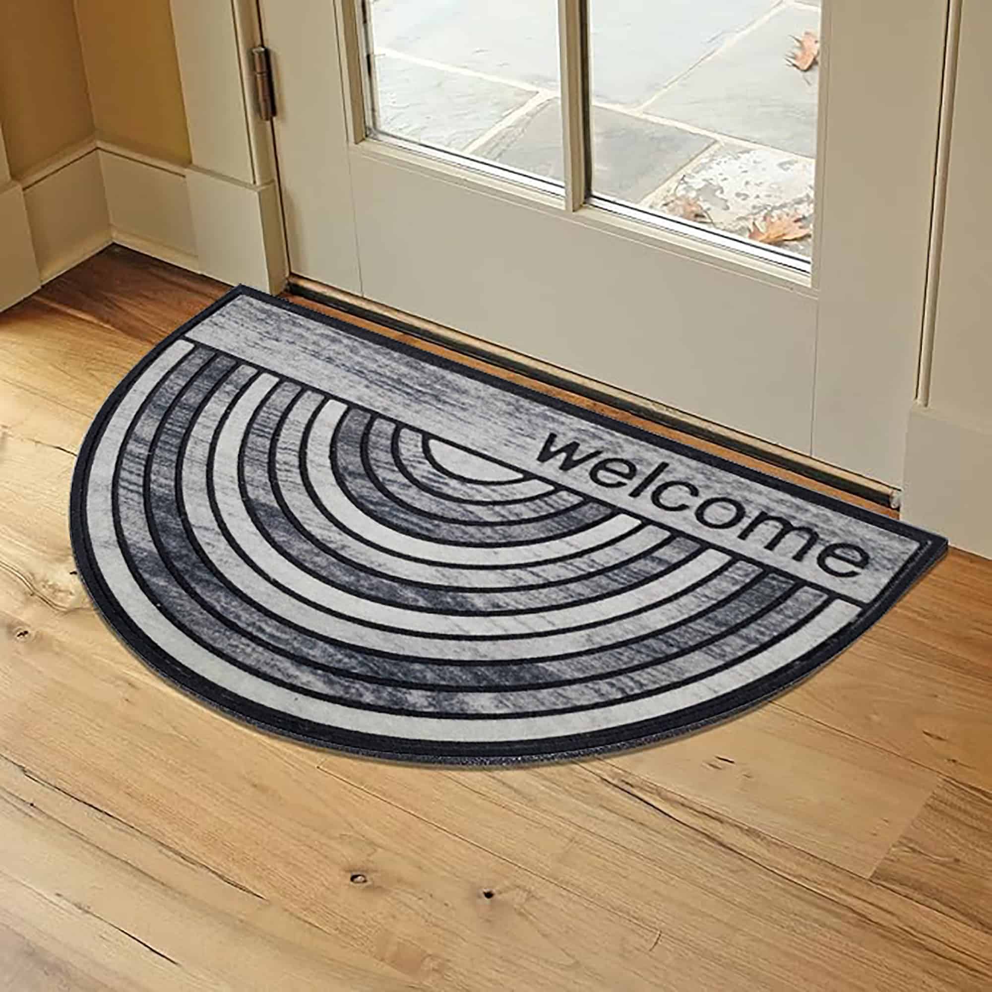 Contemporary welcome mat placed near a wooden entryway for a warm and inviting look.