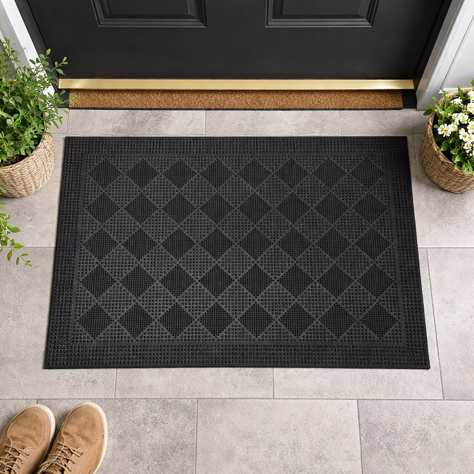 Top view of black rubber door mat with checkerboard texture