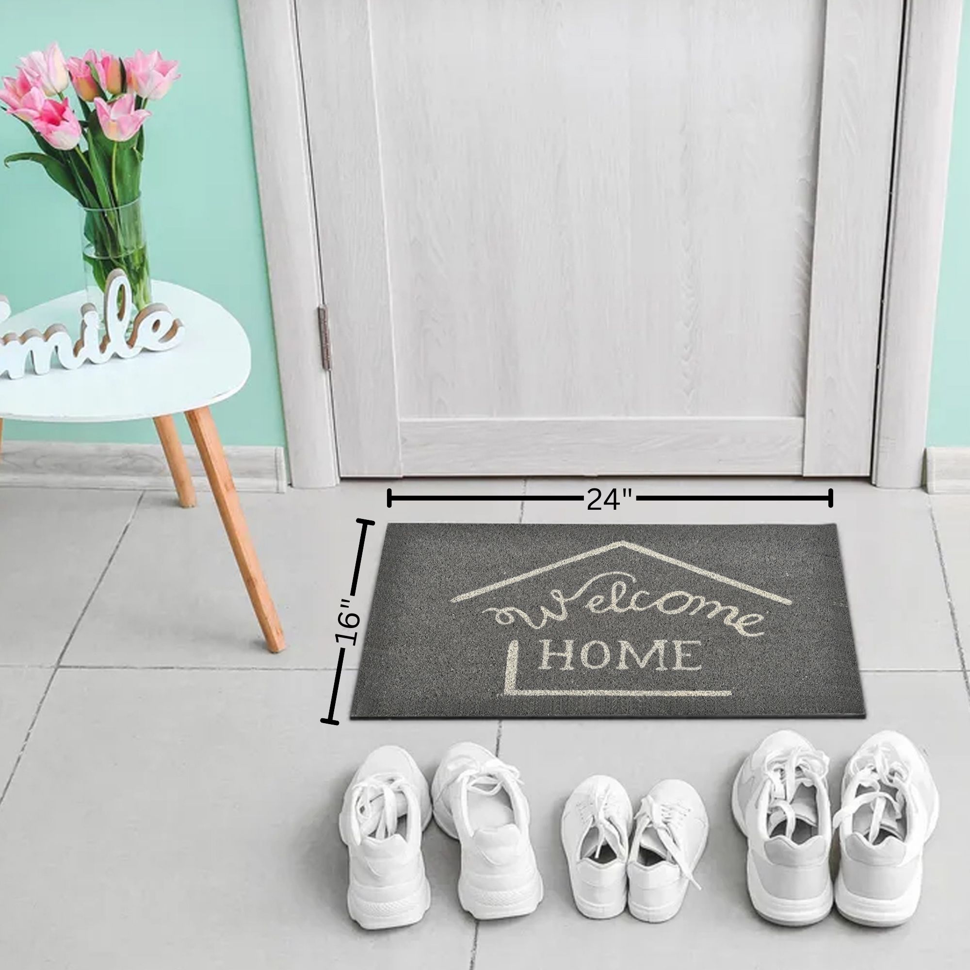Grey welcome home doormat 24x16 shown in entryway with shoe lineup