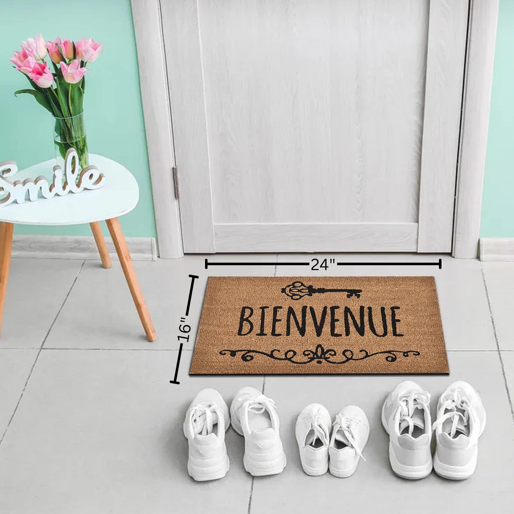 Bienvenue coir doormat 24x16 shown in entryway with shoe lineup