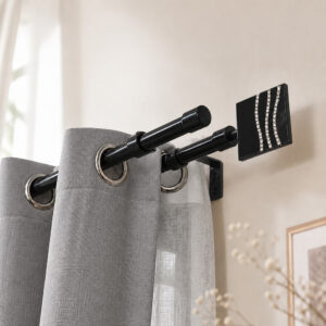 Black double curtain rod mounted above a window, grey drape on the front rod and sheer panel on the back rod