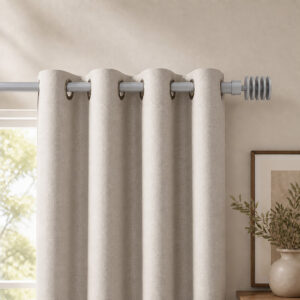 Matte grey 1 inch curtain rod above a living room window with ivory grommet curtains