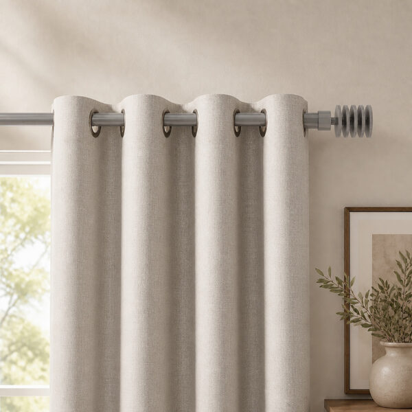 Taupe 1 inch curtain rod from the 2 pack above a living room window with ivory grommet curtains