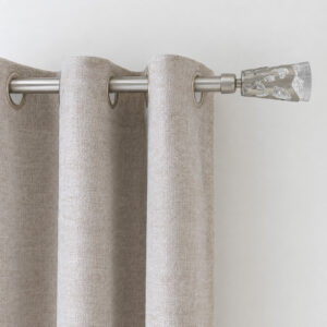 Silver 3/4 inch curtain rod with frosted leaf finial holding grommet curtain panels