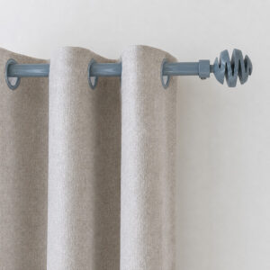 Blue gray 3/4 inch curtain rod with spiral ball finial holding grommet curtain panels