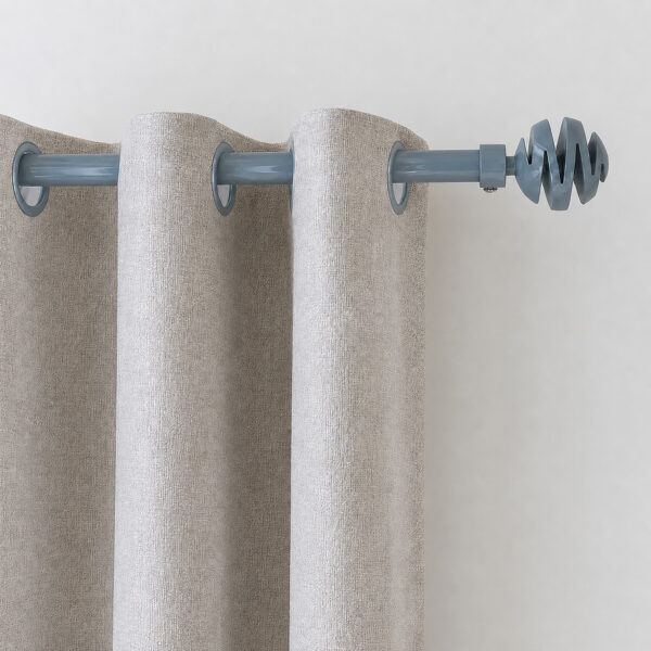 Blue gray 3/4 inch curtain rod with spiral ball finial holding grommet curtain panels