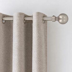 Close-up of the silver ball finial on a 1-inch curtain rod, with oatmeal curtains