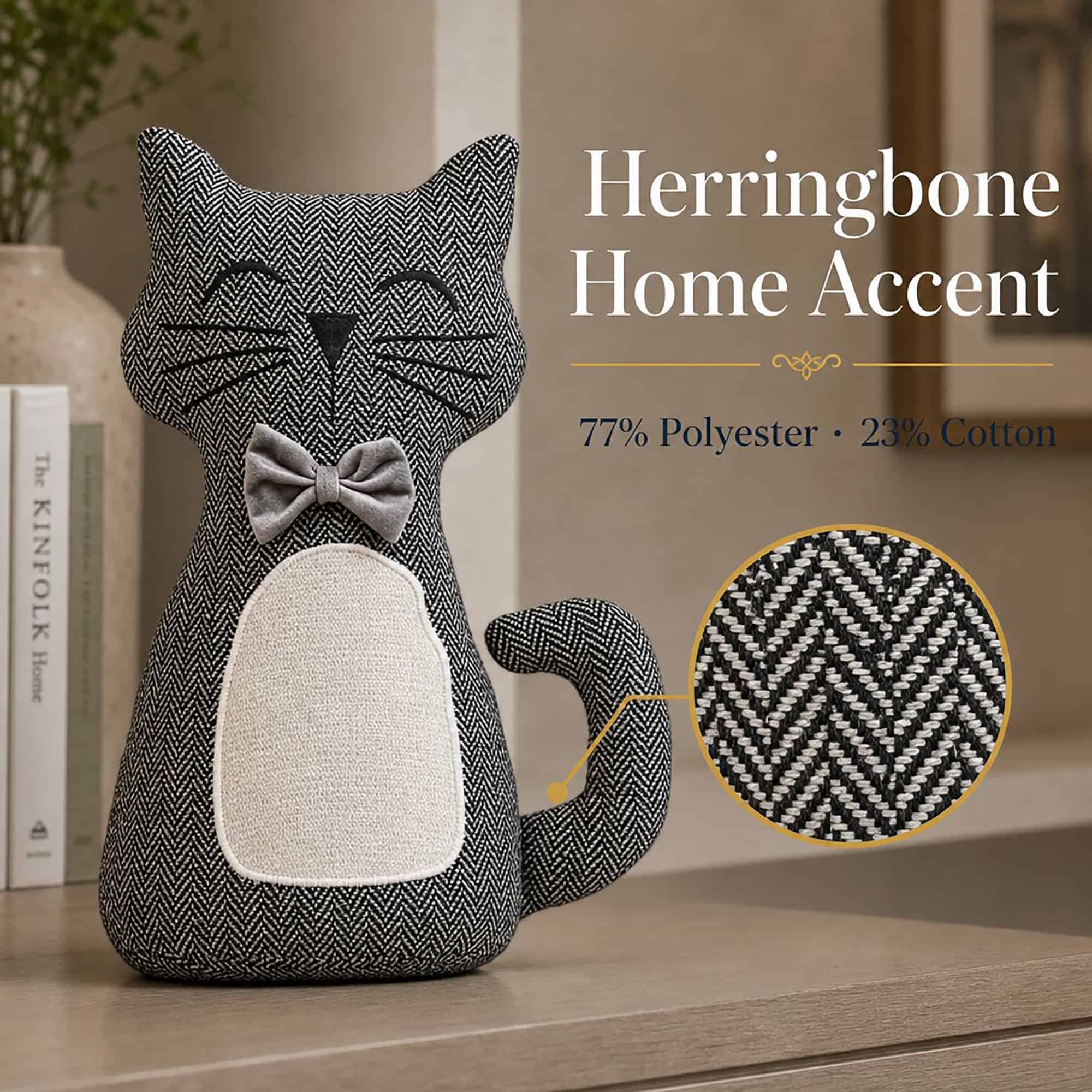 Charcoal cat door stopper on a wood surface beside books, with a magnified circle showing the herringbone weave. On-image text: "Herringbone Home Accent," "77% Polyester · 23% Cotton."
